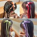 Bow ribbon tassel girl 2 piece hair clip set with bow decoration. 