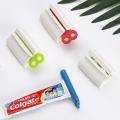 【FUN LIVE】 1Pc Rolling Tube Toothpaste Squeezer Dispenser Stand Holder For Bathroom Plastic Cream Tube Squeezing Dispenser ( Random Color ) By JUST4U. 