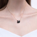 SWAROVSKI Iconic Swan Necklace and Earrings Collection, Rose Gold Tone Finish, Black Crystals. 