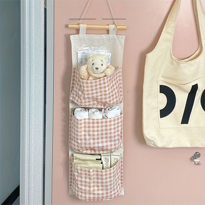 Pink%20Storage%20Bag%20Rack%20Canvas%20Wall%20Mounted%20Bedroom%20Storage%20Bag%20Multifunctional%20for%20Books,%20Jewelry,%20and%20Miscellaneous%20Items,%20-%20Image%203