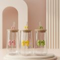 Transparent Bow Glass Cup with Bamboo Lid & Straw – Perfect for Juice, Coffee & Smoothies (Random color). 