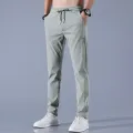 2024 Ice Silk Men's Pants Summer New Black Gray Thin Business Casual Pants Outdoor Elastic Breathable Straight Leg Sweatpants. 