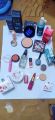 14 in 1 makeup deal. fixer, Pink magic, Cool Betty concealer stick, Romantic may lipstick, loose powder, primer, face powder, Beauty bank blush on, Cosmee highlighter, 4in1 glitter,base, Nail paint, 2in1 gel liner. 