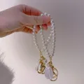ZAKOL Cute Pearl Keychain for Women Girls Shiny Pearl Bead Shell Phone Bag Backpack Charm Accessory Car Key Key Chain Pendant. 