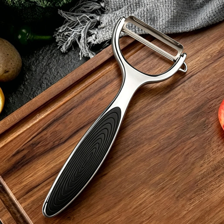Stainless%20Steel%20Kitchen%20Peeler%20Multi-Function%20Kitchen-Specific%20Peeler%20for%20Slicing%20Fruit%20and%20Vegetables%20with%20Wooden/%20Steel%20Handle%20-%20Image%207