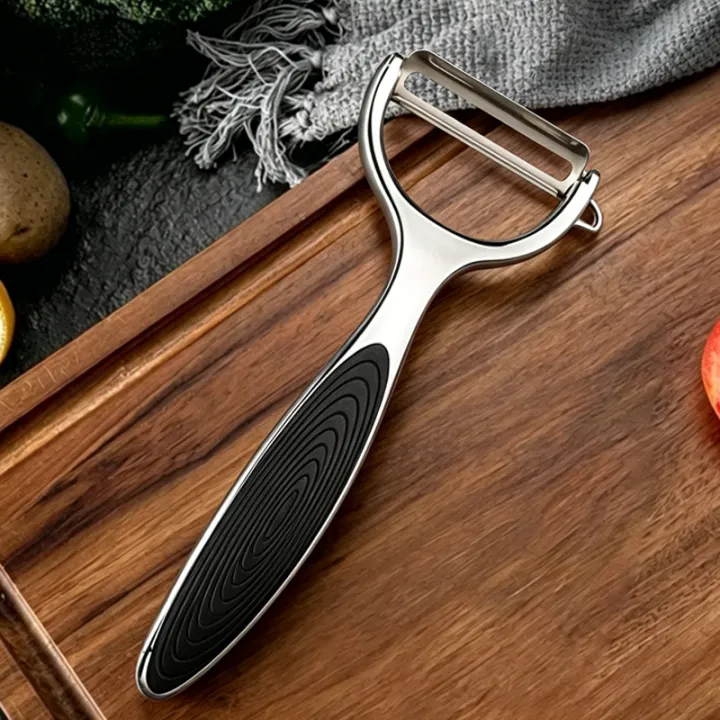 Stainless%20Steel%20Kitchen%20Peeler%20Multi-Function%20Kitchen-Specific%20Peeler%20for%20Slicing%20Fruit%20and%20Vegetables%20with%20Wooden/%20Steel%20Handle%20-%20Image%207