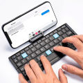 Folding Mini Wireless Keyboard with Stand for Tablet Phone Laptop Bluetooth Keyboard for Android IOS Windows Office Accessories. 