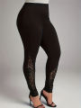 Plus size  Women's oversized leggings with lace patchwork and contrasting hollow out design, slim fit and slimming pants. 