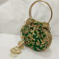 latest potli pouch purse clutch bag with round metal handle. 
