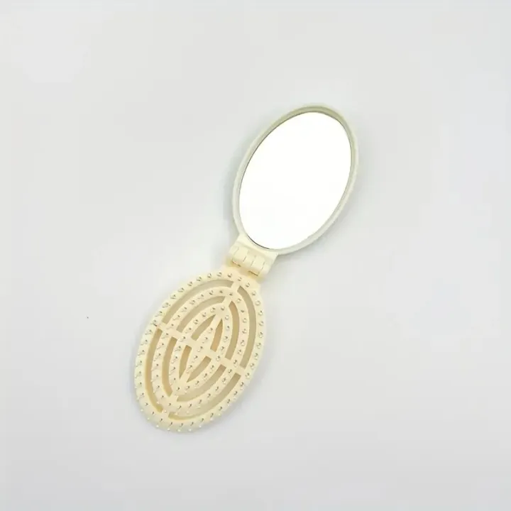 Portable%20Folding%20Hair%20Comb%20with%20Mirror,%20Lightweight%20&%20Travel-Friendly%20for%20On-the-Go%20Styling.%20A%20Perfect%20%20for%20Women%20&%20Girls.%20-%20Image%207