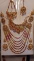 Bridal Jewellery set in Red and Golden colour with beautiful Crystal mala, bindeya and jhumer. 