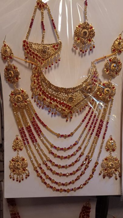 Bridal Jewellery set in Red and Golden colour with beautiful Crystal mala, bindeya and jhumer