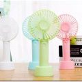 Portable mini rechargeable travel fan for indoor and outdoor use.