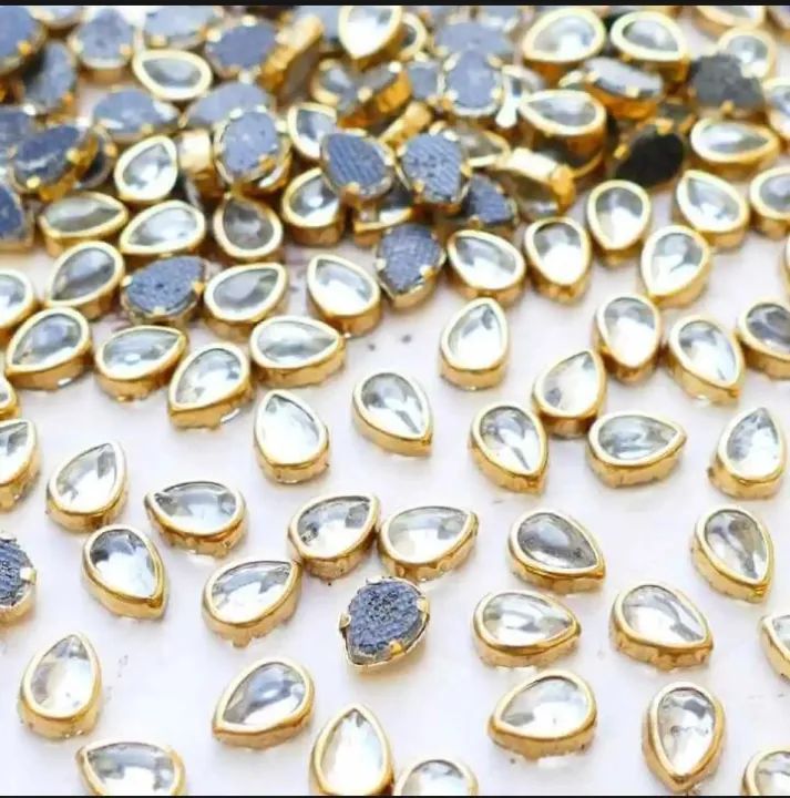 Rs.%20250%0A%0A50%20Tear%20Drop%20Shape%20white%20color%20flat%20back%20Crystal%20Kundan%20stone%20(6*4mm)%20-%20Image%202