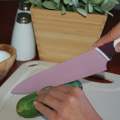 (D). 8" CHEF KNIFE WITH SHARPENING SHEATH. 