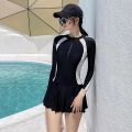 Women’s Long Sleeve Swimsuit with Skirt and Attached Shorts. 