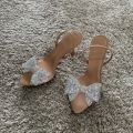 2025 Women Summer Bow Rhinestone Slingback Pumps Fashion Lady Transparent High Heels Sandals Elegant Pointed Toe Heels.