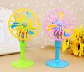 Mini toy fan floor standing for kids play. 