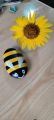 stone painting of honey bee. 