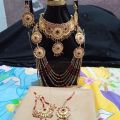 Bridal Jewellery set in Red and Golden colour with beautiful Crystal mala, bindeya and jhumer. 