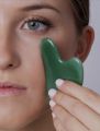 Natural Gua Sha stone for skincare routine. 