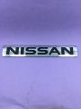 Nissan monogram logo, emblem, trademark, sign, mark, symbol, stamp, monogram, motif, badge, design, shield or figure. 