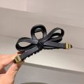 1/2 PC 2026 Y2K ladies' new street style elegant gold label black leather butterfly knot large-sized matte clutch hair accessory. 