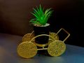 Metalic Trolley with artificial plant. 
