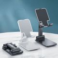 Desktop mobile Holder stand for phone adjustable foldable mobile phone stand. 