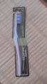Reach essential care plastic tooth brush. 