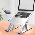 Foldable Adaptable Laptop Stand Foldable Ventilated Cooling stand Portable Aluminum Laptop Riser Desk Laptop Holder with Non-Slip Rubber Grip Portable foldable adjustable & compatible with all laptop sizes silver & black color available size 9.1* 6.1*6.1. 