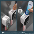 MENGNI Toothpaste Dispenser Wall-Mounted Bathroom Toothpaste Squeezer Punch-Free Toothbrush Holder Rack manual operation.