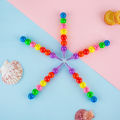 7 Color Crayons Cartoon Smiley Face. 