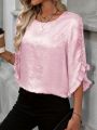 Ladies' large woven solid color casual elegant shirt.
