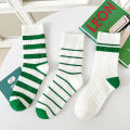 Children's socks in three pairs, spring and autumn style, simple and versatile, green striped socks for boys and girls. 