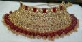 bridal first day jewellery heavy set in golden and red colour unique and stylish design. 