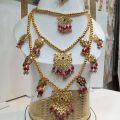 Traditional 3 Layer Dhuri Set in Manjus with Tikka and Double Jhumki – Raaikal Jewels. 