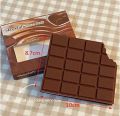 Chocolate-Shaped Pocket Notebooks: Memo Pads with Real Chocolate Fragrance. 
