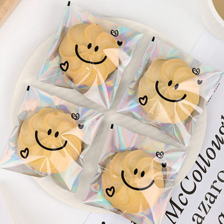 100pcs%20Cute%20Smiling%20Face%20Cookie%20Packaging%20Bag%20Laser%20Transparent%20Biscuit%20Bag%20Self-adhesive%20Bag%20Birthday%20Party%20Wedding%20Decoration%20-%20Image%206