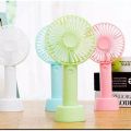 Portable mini rechargeable travel fan for indoor and outdoor use.