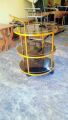 Tea Trolley circular shape golden color three shelf. 