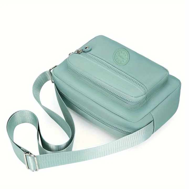 Lightweight%20Nylon%20Chic%20Crossbody%20Bag%20for%20Women%20-%20Adjustable%20Strap,%20Zip%20Closure,%20Tassel%20Accent,%20Solid%20Color%20-%20Image%202