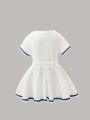 Summer girls' sporty style two-piece set with heart cartoon pattern print, pleated short skirt and short-sleeved T-shirt. 