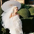 A white paper umbrella for wedding decoration - handmade traditional Chinese bridal sunshade - photo prop and party accessory.