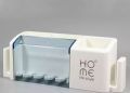 1 pc adhesive Wall and Table Pen Holder and Tooth Brush Dispenser. 