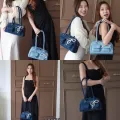 Cicelle shoulder bag oven modern denim fabric with Pearl knot pendant. 