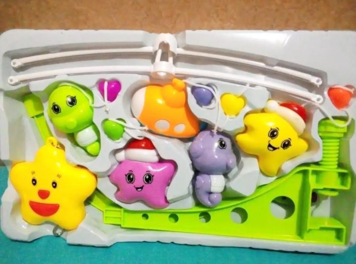 Happy shaking bell. baby musical crib toy with hanging, rotating toys.