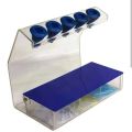 Micropipette stand with tip container. 