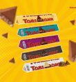 Toblerone Chocolate Bar, Enjoy Toblerone, The Iconic Triangular Chocolate from Switzerland (Pack of 4 Milk, Dark, White, Fruit & Nut). 
