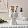 A Creative Face Storage Box – a Desktop Organizer with a Brush Holder for Storing Makeup Brushes Amagi. 